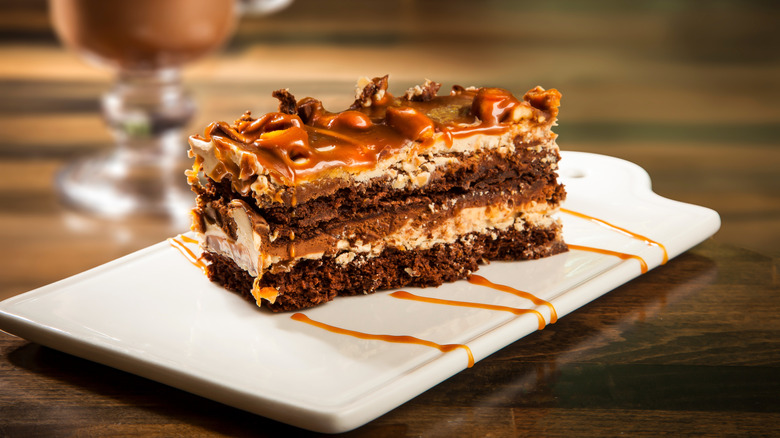 Rectangular slice of chocolate caramel layer cake