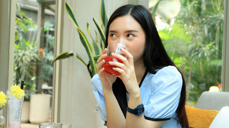 Gen Z customer having a drink