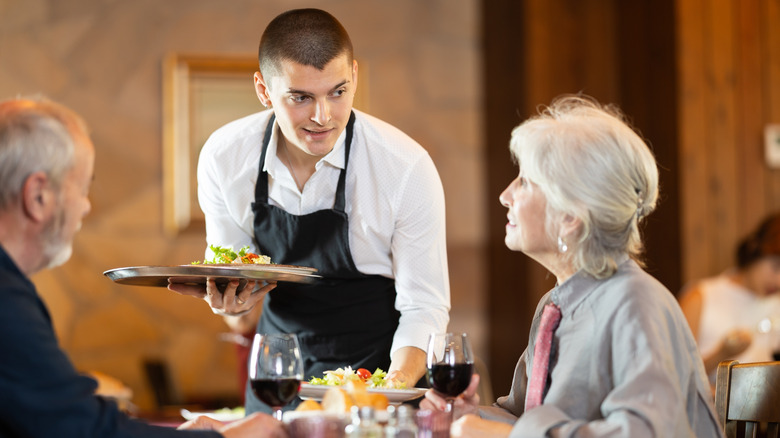 Old patrons engaging with server