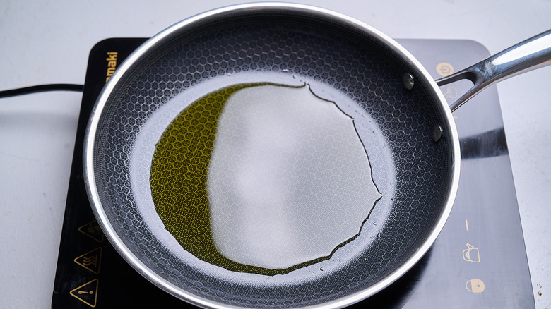 heating oil in a skillet