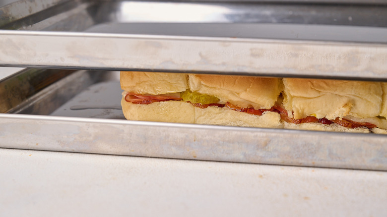 pressing sliders between sheet trays