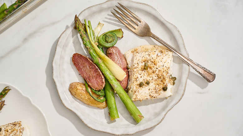 halibut and vegetables on a plate