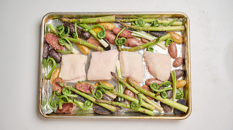 vegetables and fish on sheet pan