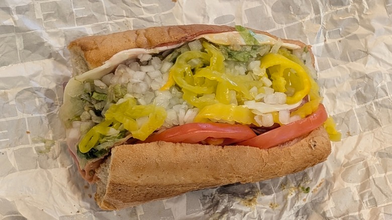 Sheetz's Italian sub stuffed with diced onion and peppers on wax paper
