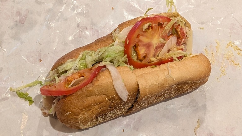Wawa's turkey sub with tomatoes peaking out on wax paper