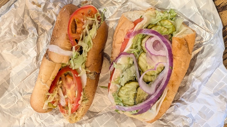 Two turkey subs from Wawa and Sheetz on wax paper