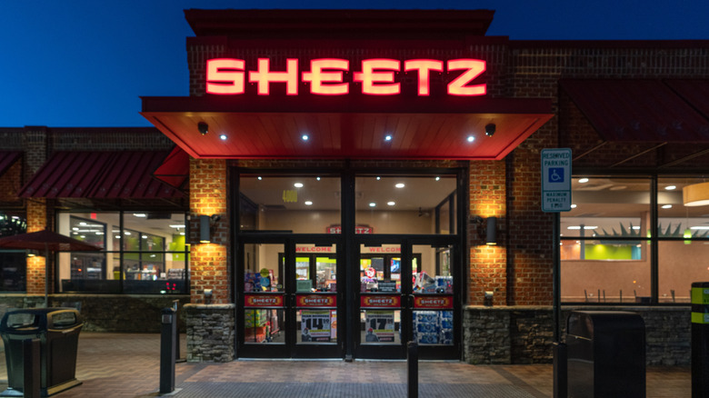 Entrantce to Sheetz at night, with a bright sign above the doors