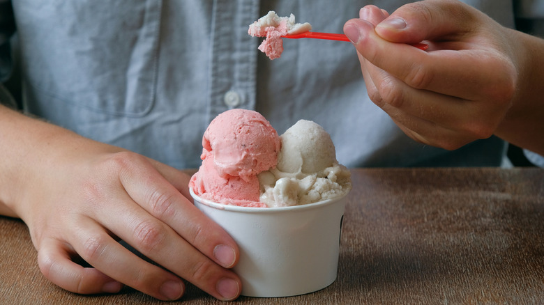 ice ream scoop next to scoop of sherbet in bowl