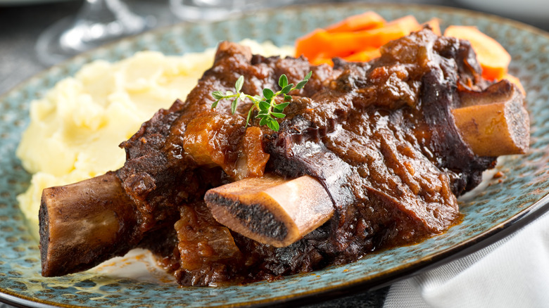 braised beef ribs with mashed potatoes and carrots
