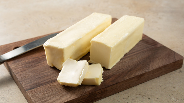 butter on wood board with knife