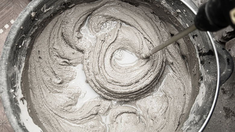 Mixing a bucket of cement