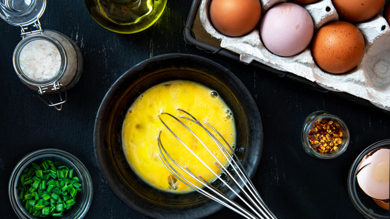 Whisking eggs for an omelet