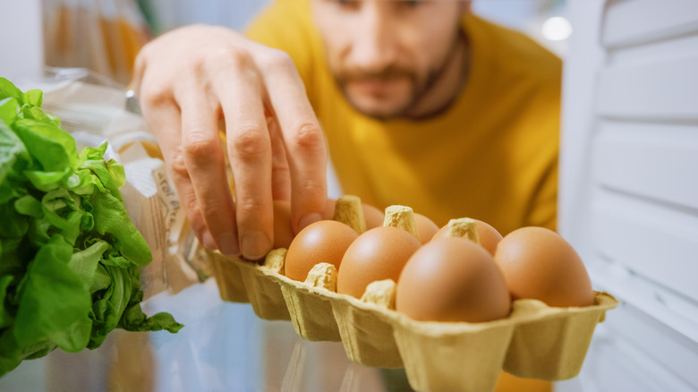 taking eggs from refrigerator