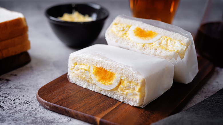 Halved Tamago Sando wrapped in deli paper