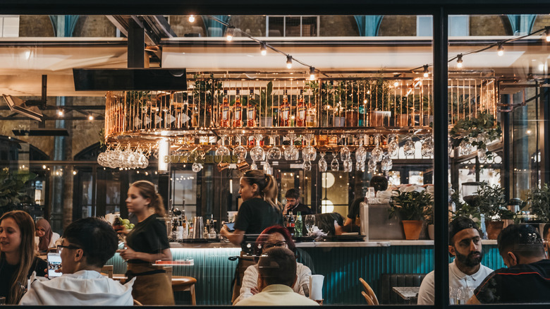 Full restaurant with busy servers