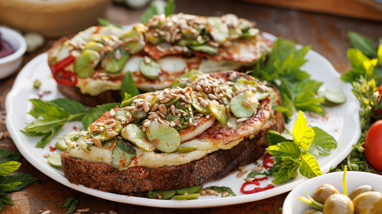 sunflower seeds on toast with humus