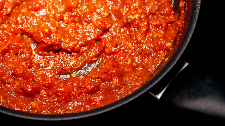 Marinara sauce in black pan