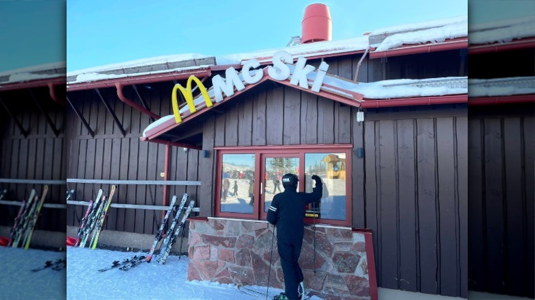 A man in ski gear looks inside the window of the McSki in Sälen, Sweden at the SkiStar Lindvallen ski resort