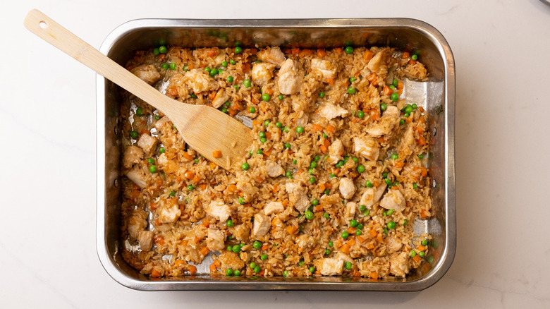 Sheet pan fried rice with wooden spatula
