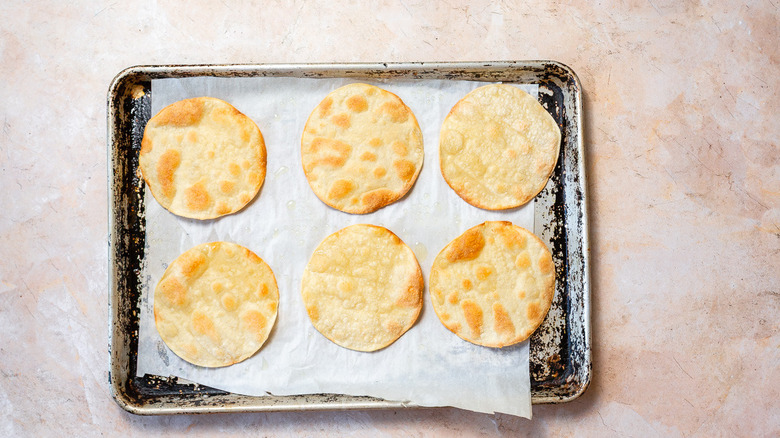 Baked tortillas on baking sheet