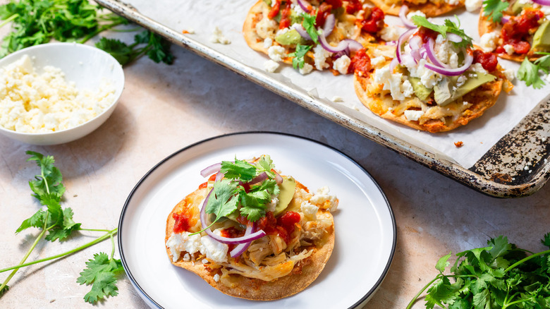 One chalupa in front of a baking sheet