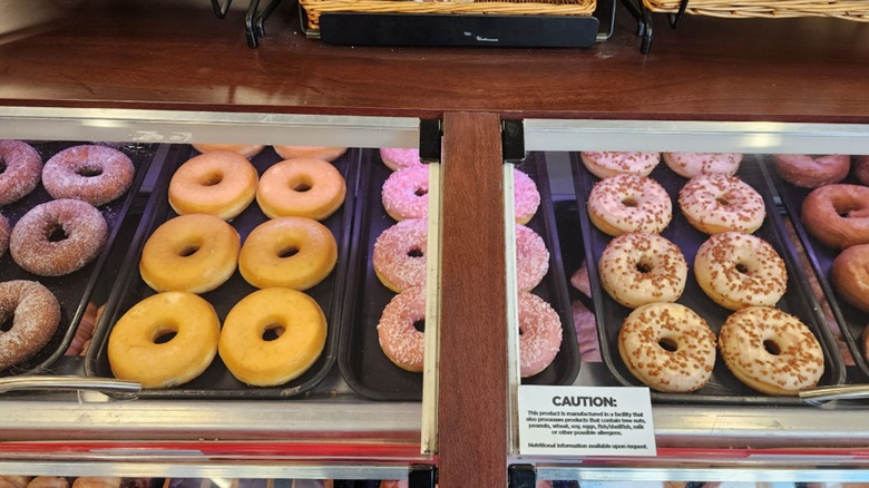 A selection of yeast donuts in a plastic case at Circle K