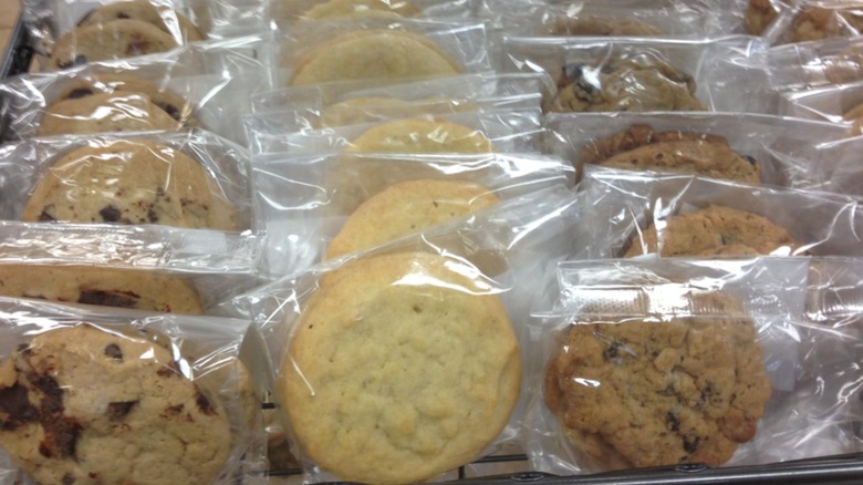 A selection of various individually wrapped cookies on a wire rack at Quick Chek