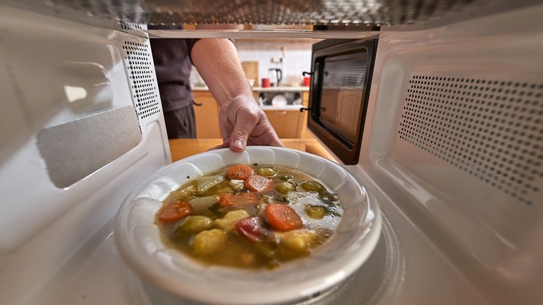 Vegetable soup heated in microwave