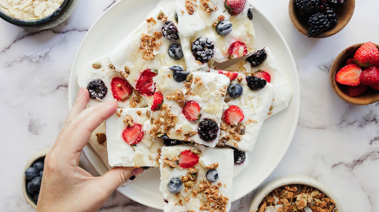 A plate of berries frozen yogurt bark squares