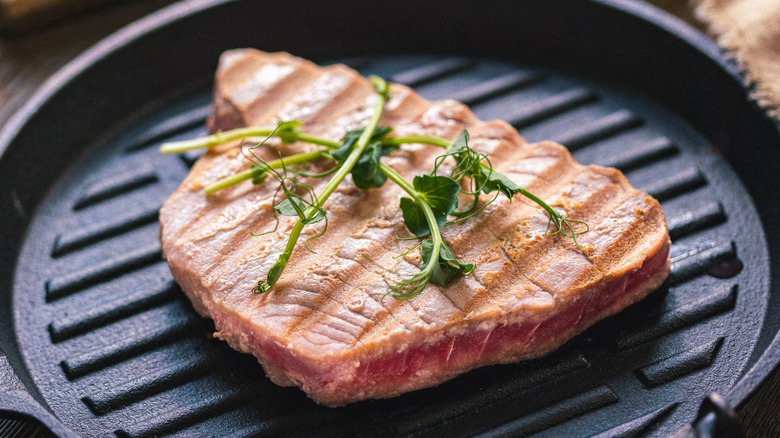 Pan-seared tuna steak in pan