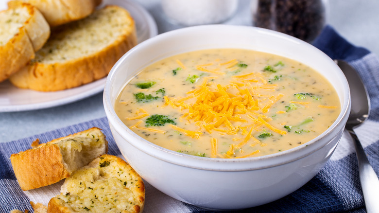 bowl of cheddar broccoli soup with garlic bread