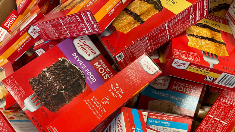 different boxes of Duncan Hines cake mixes in a pile