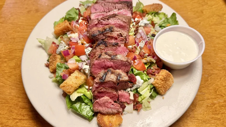 Texas Roadhouse's Steakhouse Filet salad with side of blue cheese derssing