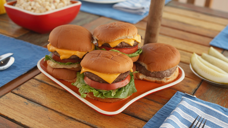 Four basic cheeseburgers on a plate