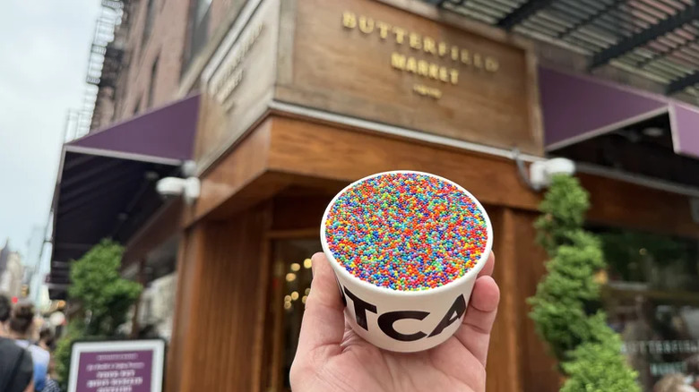 hand holding a Dotcake in a cup