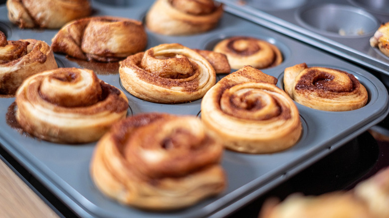Cinnamon rolls in a muffin tin