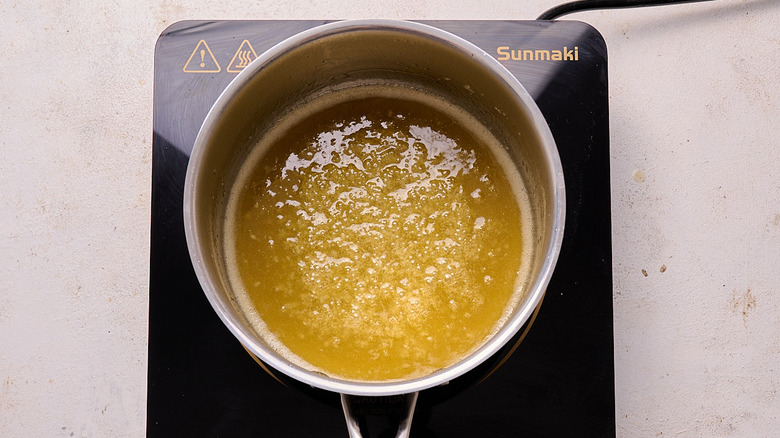 aerial view of simmering honey in a saucepan