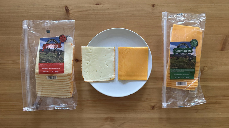 Packages of Trader Joe's sliced cheese on wooden table