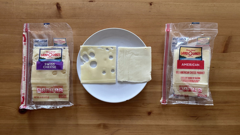 Packages of Land O'Lakes sliced cheese on wooden table