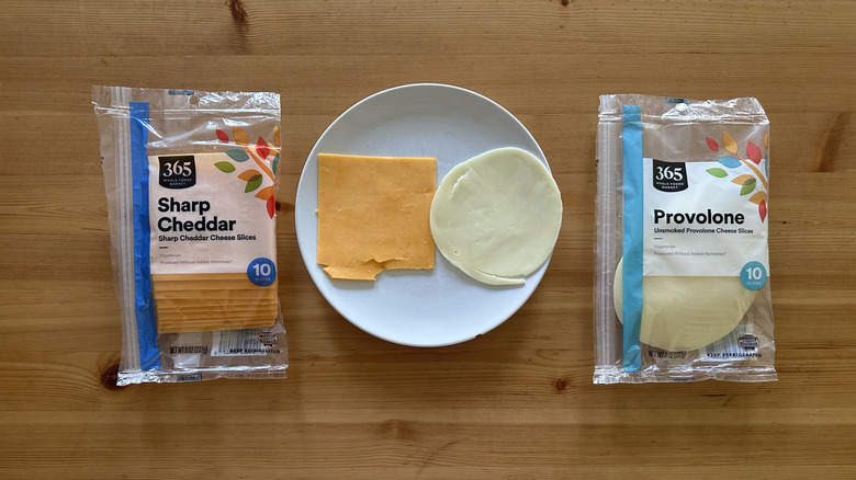Packages of 365 sliced cheese on wooden table