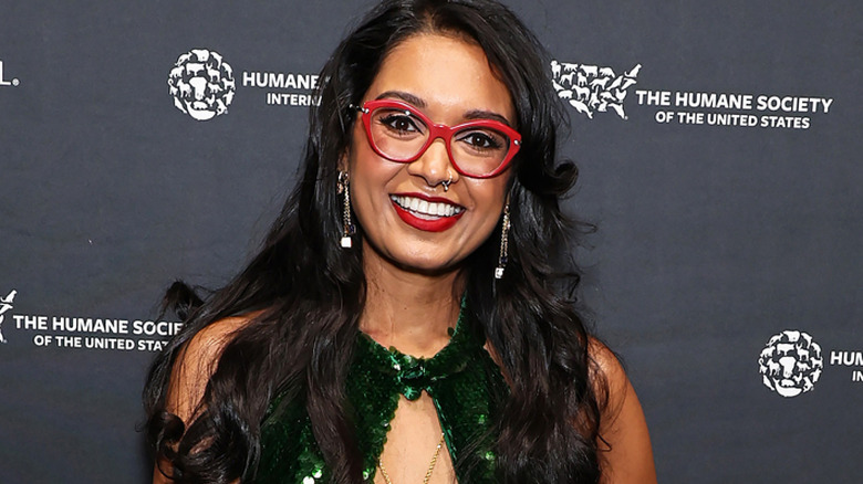 Priyanka Naik smiling for photo at a carpet event