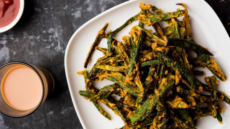 crispy okra on plate with dipping sauces