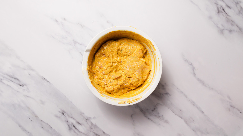 Marinade and chicken in large bowl