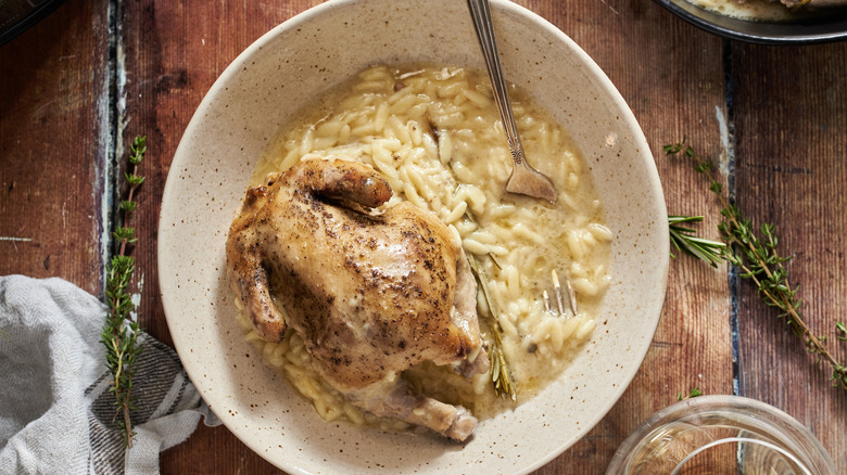 cornish hen in bowl with orzo
