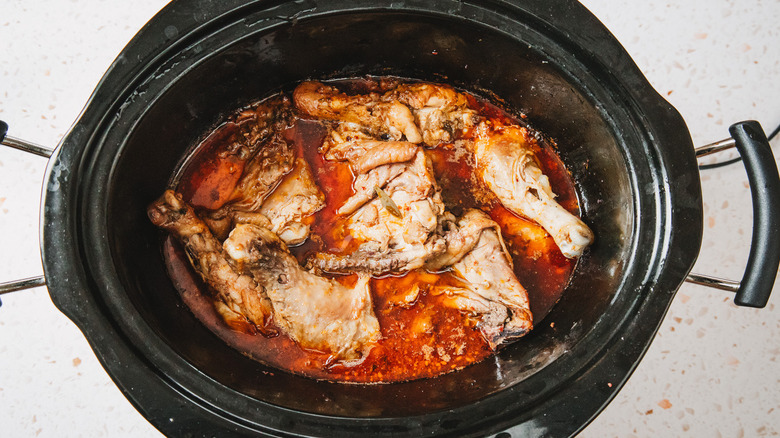 Chicken parts in red sauce