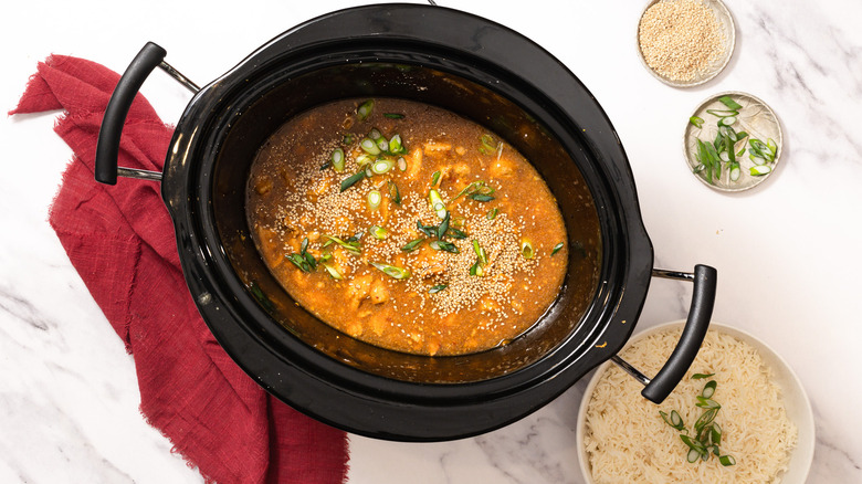 Slow cooker orange chicken with scallions and sesame seeds