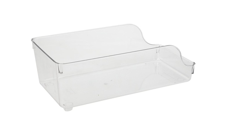 A plastic soda can organizer on a white background