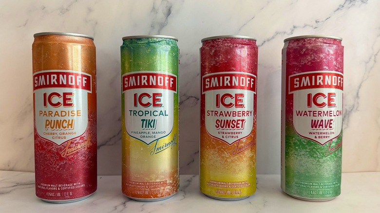 Four Smirnoff Ice Icy Island cans on marble surface