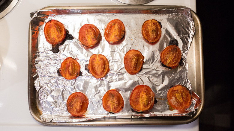 roasted tomatoes on baking sheet