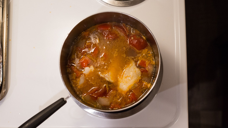 fish soup cooking in pot